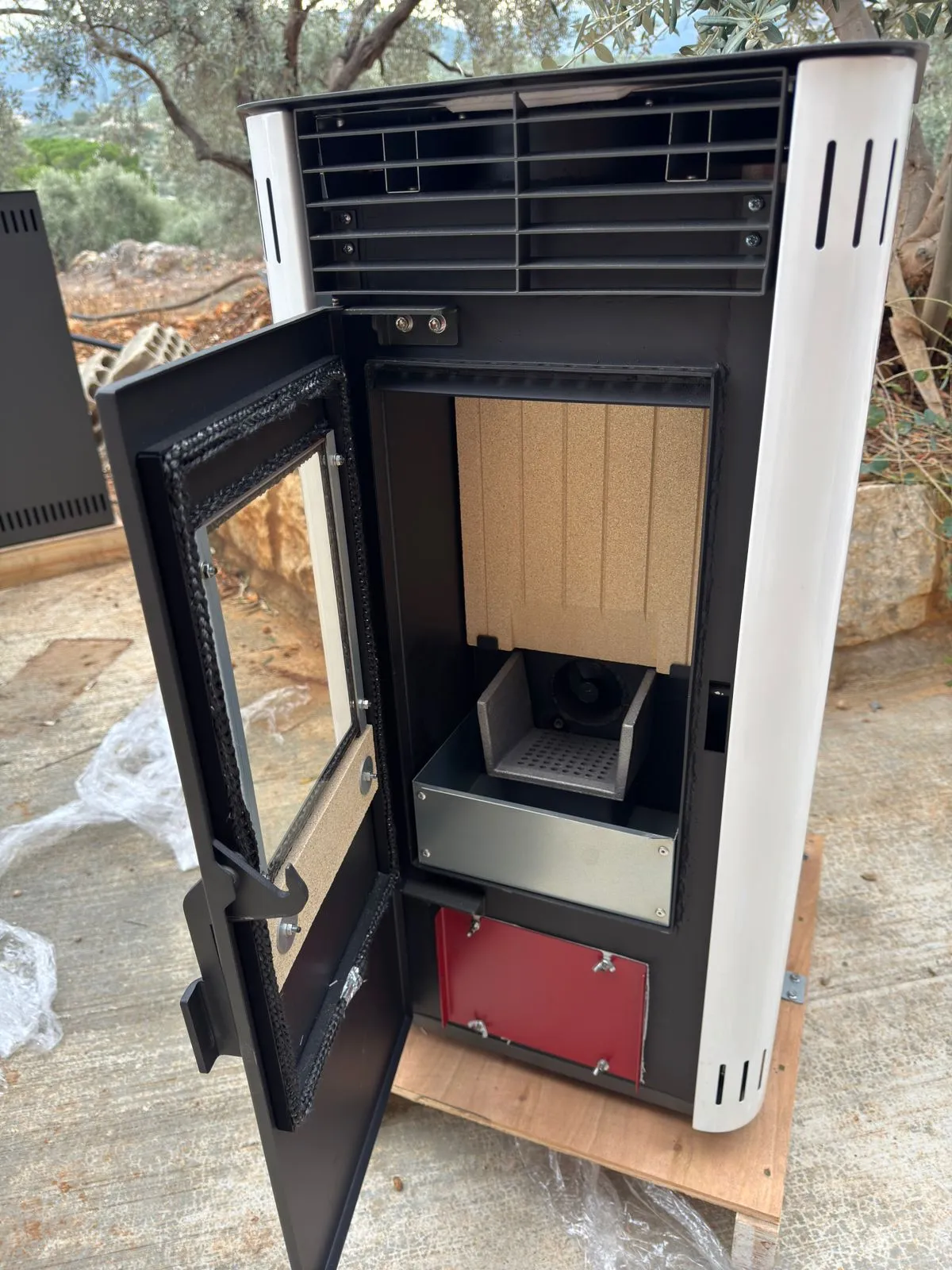 The 10KW with its firebox open: burn pot and lined chamber