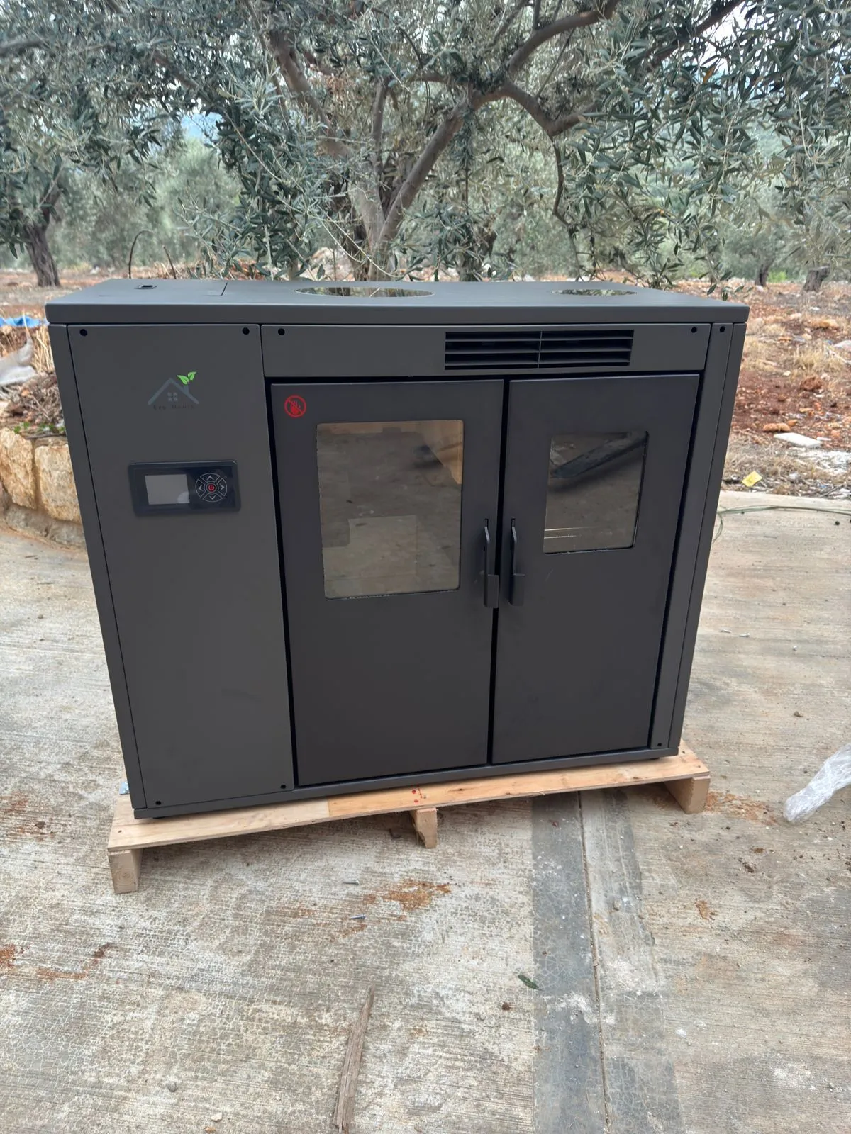The 12KW air pellet cooker, closed — oven and firebox behind the double doors