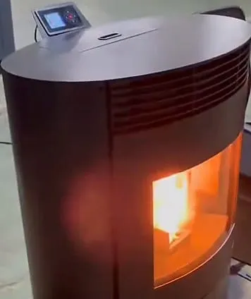 The round 15KW pellet stove lit, seen from the side, with the control screen on top