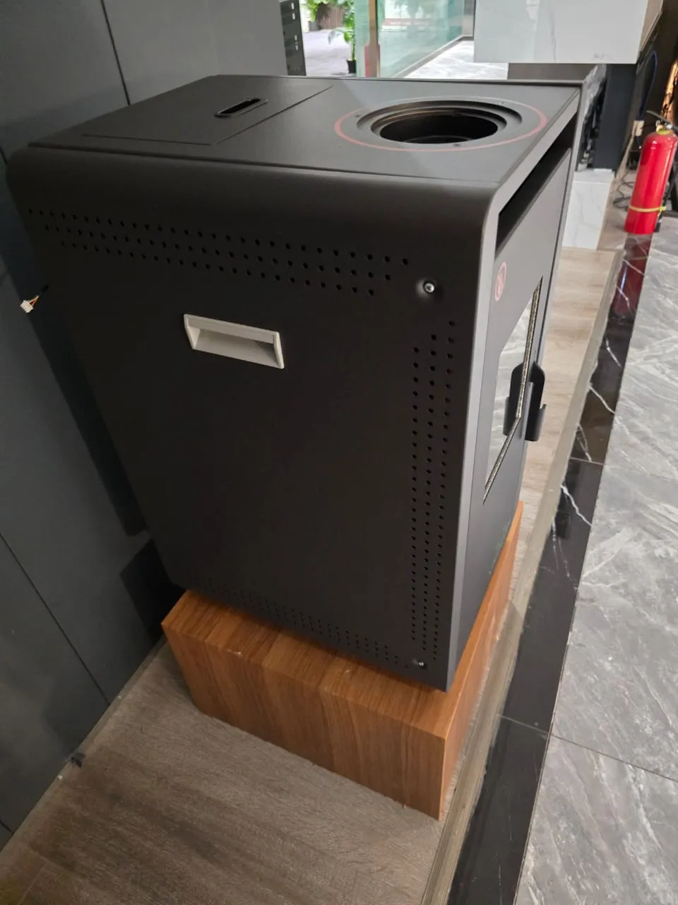 Top view of the graphite pellet stove showing the round cooktop ring